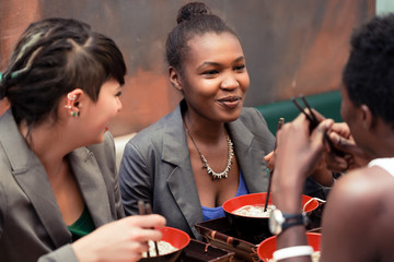 Friends eating noodle soup in Japanese Restaurant