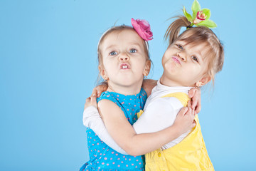 two little sisters in color clothes  © nuzza11