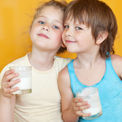 happy children are drinking the milk 
