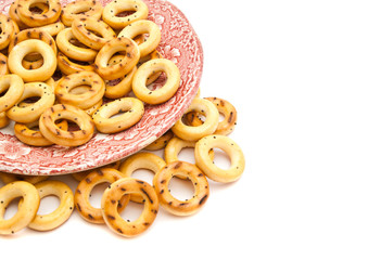 bagels on a pink plate on white