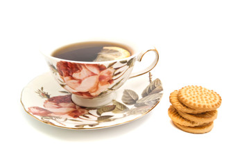 cup of tea with lemon and cookies