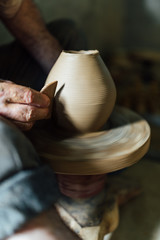 The ceramist make vase from clay