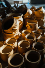 There are many  terracotta pots in the floor