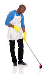 african american man sweeping