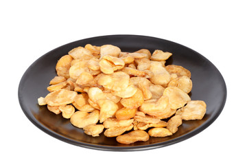 Nuts on plate isolated on white background.