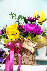 bouquet of fresh yellow tulips  on green background