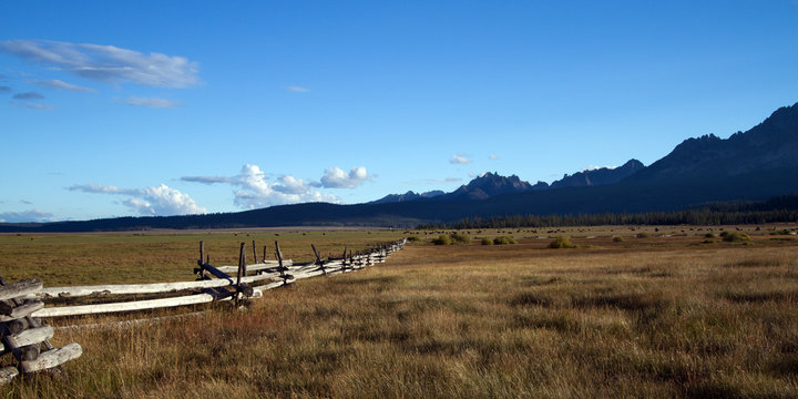 Fields, fences, and the Sawtooth Mountains near Stanley, Idaho