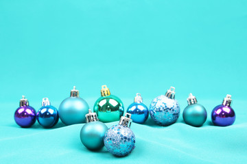 Blue Christmas tree ornaments on blue background