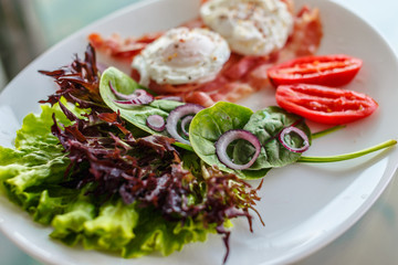 Vegetarian salad on white plate.