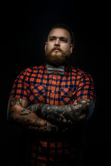Man with beard and tattooes.