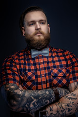 Man with beard and tattooes.