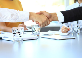 Business people shaking hands, finishing up a meeting