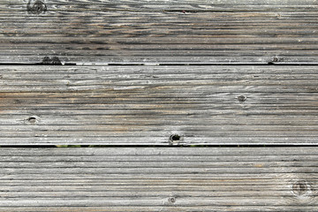 Fototapeta premium Vintage fence from boards of larch with the noble gray and red t