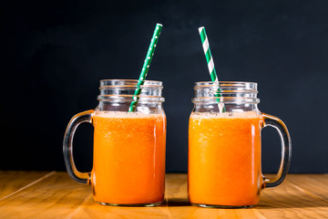 Carrot juice in masons jars