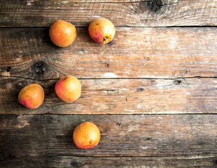 Obraz na płótnie Canvas Fresh apricots on wooden background. fruit