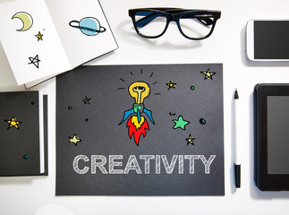 Creativity concept with black and white workstation