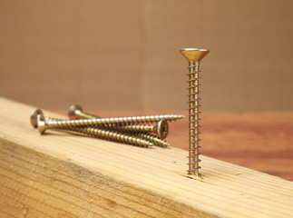brass screw closeup, shallow depth of field