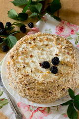 Homemade chocolate cake and cheese butter cream on a wooden tabl