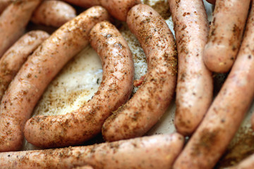 preparing sausages on fire