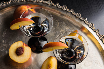 Vodka and martini with fresh peaches