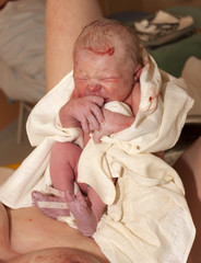 mother with her newborn baby after birth