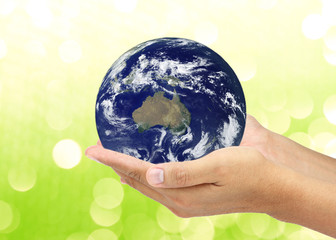 Saving the World on green bokeh background. Elements of this ima