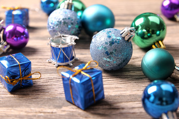 Christmas ornaments on wooden surface