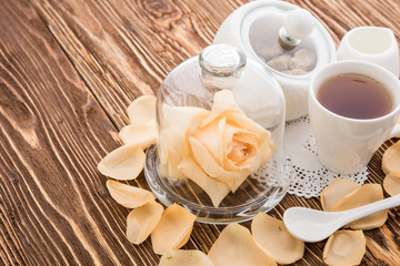 Tea cups with teapot on old wooden table