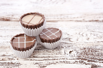 Dark chocolate on wooden background