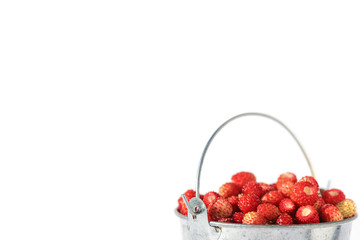 Isolated small bucket full of strawberries