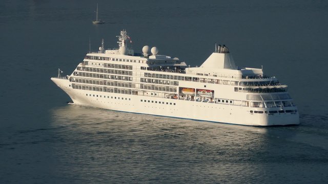 Cruise Ship Moving On Calm Sea In The Evening
