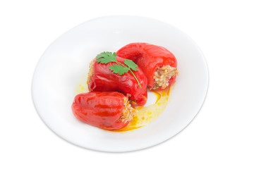 Cooked stuffed bell peppers on a white dish