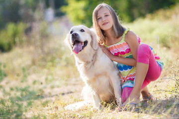 Portrait of a Girl with her beautiful dog outdoors.
