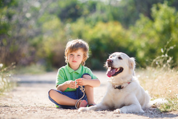 Boy with a dog on the nature