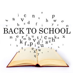 Back to school, word on the book with letters flying