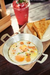 egg dish Breakfast served with fried egg, ham delicious.
