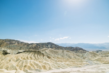 Dry and arid sand dune landscape of Death Valley National Park at Zabriskie point