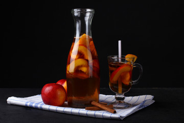 the peach compote with cinnamon on a napkin on a black background