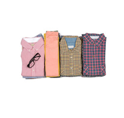 pile of mens plaid shirts with sunglasses