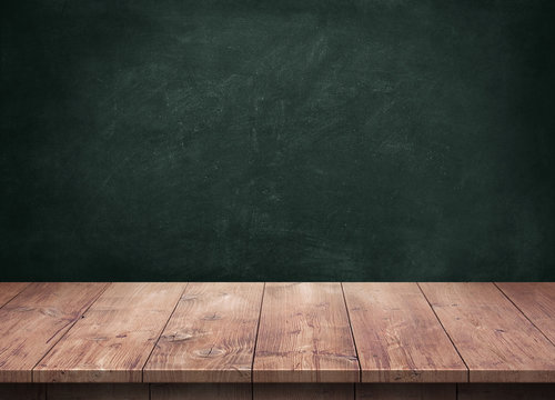 Wood table with blackboard background