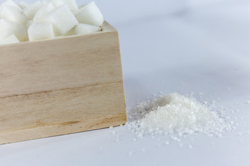 Sugar Cubes in Square Shaped Bowl on Isolated White Background