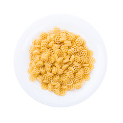 Plate of pasta seen from above isolated on white