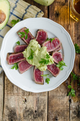 Beef steak with avocado dip and herbs