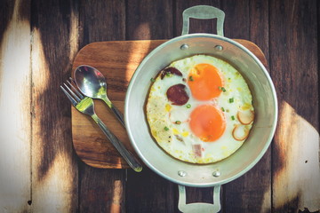 egg dish Breakfast served with fried egg, ham delicious.