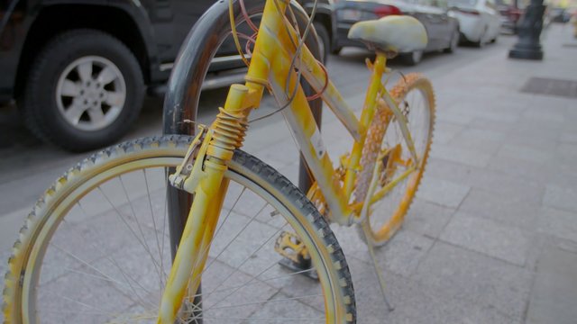 Yellow Bike with Downtown Train