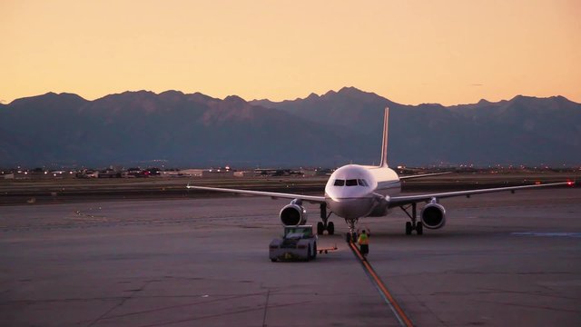 Plane Prepares to Depart at Sunrise