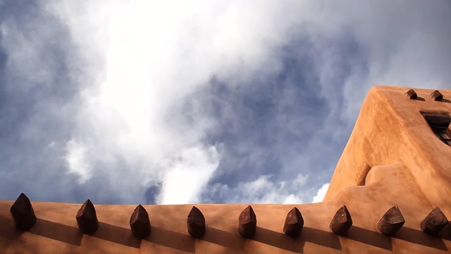 Clouds and Roof Line of Adobe Building