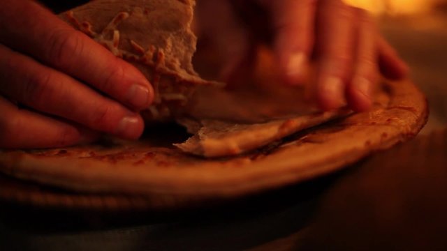Breaking Bread for Communion Tight Pan Shot
