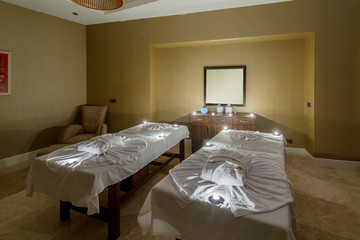 Spa room with burning candles