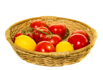 Garden tomatoes basket on white background